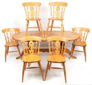 A late 20th century pine kitchen table, 73cm H x 182cm W x 95cm D together with six chairs.