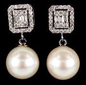 A pair of 18K white gold cultured pearl and diamond drop earrings, total diamond weight 0.51