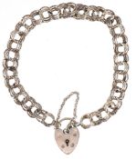 A silver multi link charm bracelet with love heart shaped padlock clasp, 18cm in length, 11.0g.