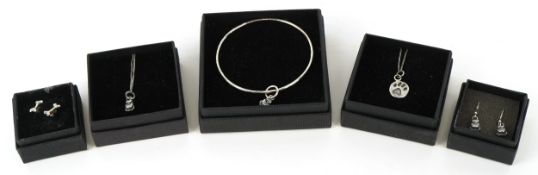 Silver and white metal jewellery including an owl pendant on chair, a bangle with an owl charm and a