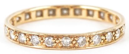 An unmarked gold diamond eternity ring, size Q, 1.9g.