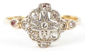 An Art Deco 18ct gold and platinum diamond cluster ring, size K, 2.1g.