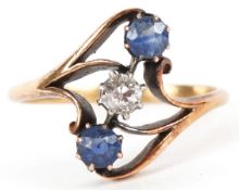 An 18ct gold diamond and sapphire crossover ring, size N, 2.9g.