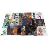 Vinyl LP records including The Beatles, The Bee Gees, Simon & Garfunkel, The Moody Blues, The