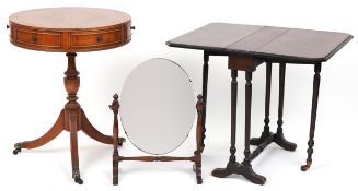 An Edwardian mahogany Sutherland table, a late 20th century walnut drum occasional table and a swing