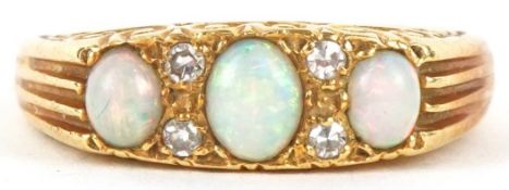 An 18ct gold graduated cabochon opal and diamond ring, Birmingham 1968, size K/L, 6.2g.