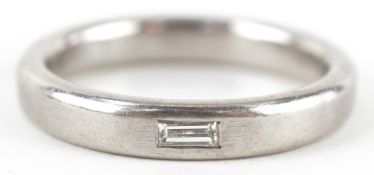 A platinum and baguette cut diamond ring, size U, 12.0g.