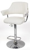 A modern breakfast bar stool with white leather back and seat raised on a chromium plate base,