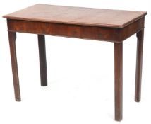 An early 19th century mahogany side table raised on block legs, (formerly a tea table), 66cm H x