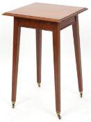 A Victorian mahogany square occasional table with secret hinged lid, raised on square tapering legs,