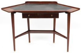 A mid 20th century mahogany corner desk fitted with a drawer, raised on tapering legs, 77cm H x