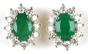 A pair of 9K gold emerald and diamond cluster stud earrings, total diamond weight 0.72 carat,