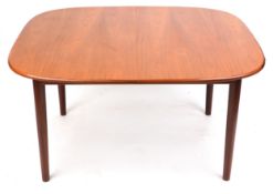 A mid 20th G Plan century teak extending dining table raised on turned legs, 73cm H x 183cm L