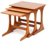A mid 20th century teak nest of three occasional tables, 49cm H x 56cm W x 44cm D.