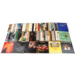 A collection of vinyl LP records including Supertramp Crime of the Century, Sinéad O'Connor I Do Not