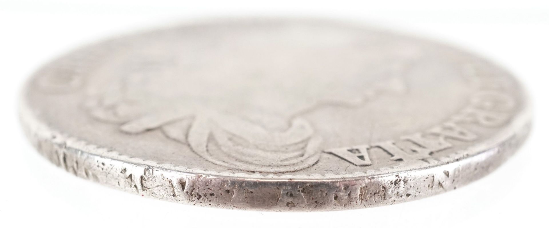 A Charles II first bust 1663 silver crown with raised script to the ...