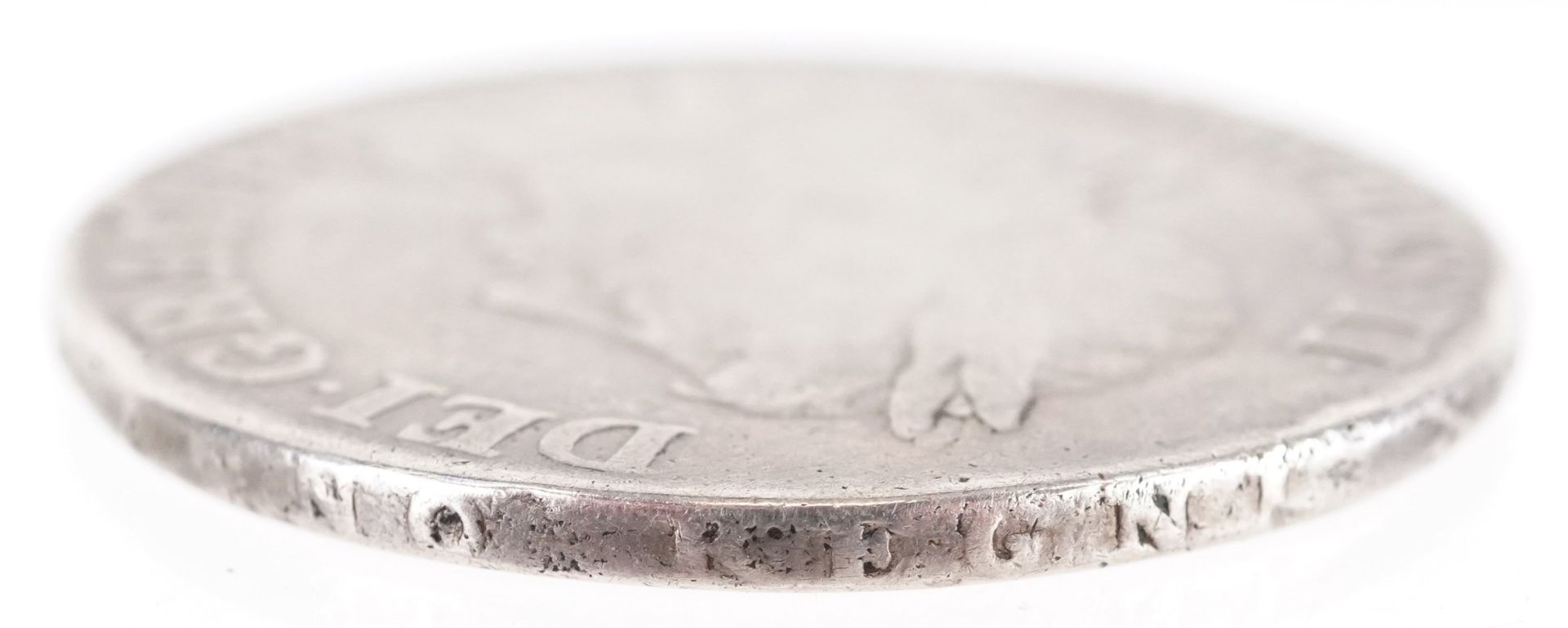 A Charles II first bust 1663 silver crown with raised script to the ...