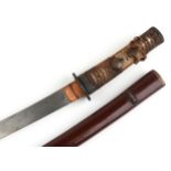 A 19th century Japanese short sword having a cloth bound shagreen grip, iron tsuba and steel