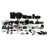 Vintage and later cameras including Canon EOS 550D, Olympus OM 101, Panasonic Lumix DMC-GX7 and