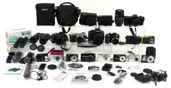 Vintage and later cameras including Canon EOS 550D, Olympus OM 101, Panasonic Lumix DMC-GX7 and