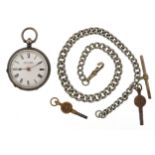 Kendal & Dent ladies silver open face key wind pocket watch and a graduated white metal watch chain,