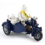 Cast iron Michelin Man on a motorcycle advertising figure, 23cm in length.