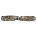 Two Victorian style silver hinged bangles, one with floral engraved decoration, Birmingham 1956