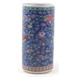 Chinese porcelain stick stand enamelled with flowers onto a blue ground, 45cm high.
