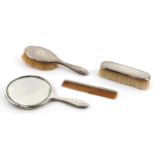 Levi & Salaman, silver mounted vanity set comprising two brushes, a comb and a hand mirror,