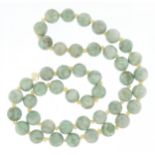 Chinese green stone bead necklace, tests as jade, each bead approximately 1.3cm in diameter, 70cm in