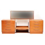 Mid century G Plan teak dressing table fitted with six drawers and mirrored back, approximately