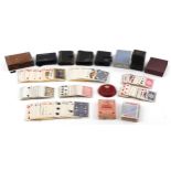 Collection of vintage playing cards with cases including a tan leather Patience card case with