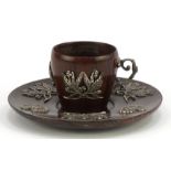 Brazilian rosewood coffee cup and saucer with white metal appliqués of branches and coat of arms,