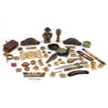 Militaria including uniform buttons, cloth patches and a compass.