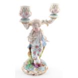 19th century Vion & Baury porcelain figural two branch candelabra modelled as a young boy reading,