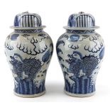 Pair of large Chinese porcelain blue and white baluster shaped jars and covers hand painted with