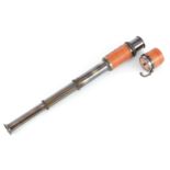 Three draw brass telescope, 32cm in length extended.