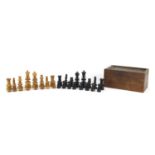 19th century box wood and ebony carved chess set, housed in a pine case, the largest piece 10cm