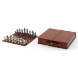 Polished metal chess set with suede interior, 7cm H x 33cm W x 33cm D.
