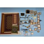 A quantity of doll's house accessories, including four carpets, fire grate, companion set, three