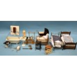 A doll's house bathroom suite of ceramic bath, loo and basin on pedestal, with copper geyser and