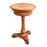 A Regency oak burr and oak work table, 1820s, the mirror veneered top enclosing a maple lined