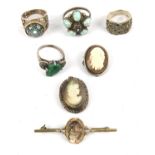 Three silver rings, two brooches and a pendant, including a shell cameo brooch with roll clasp,