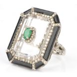 Statement Art Deco style dress ring, set with central oval cut emerald approx. 0.22 carats,