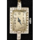 Diamond set cocktail watch in platinum the unsigned dial with Arabic numeral hour markers,