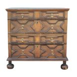 A William and Mary oak chest of drawers, circa 1700, in two parts, the tiple plank top with a