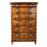 A French Restauration mahogany chest of drawers, 1820s, the front mirror veneered and with a