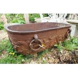 A Continental cast iron planter, 19th Century, with two ring handles, moulded with flowerheads and