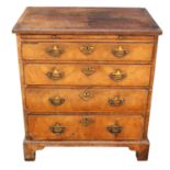 A small George I walnut and featherbanded chest of drawers, 1720s, the quarter veneered banded top