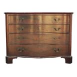 A George III mahogany dressing chest of drawers, of serpentine outline and inlaid with stringing,